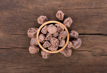 Salted Plum on wooden Background