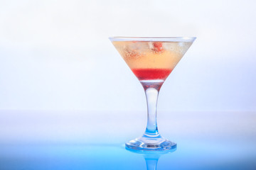 cocktail in a glass on a beautifully illuminated background