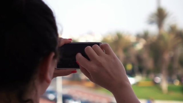 High quality video of woman taking pictures on the vacations in real 1080p slow motion 250fps 	