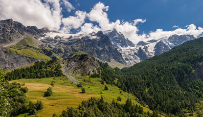 Summer view of the mountains and glaciers of the Ecrins National Park (La Meije and Glacier du Tabuchet) from the village of La Grave. Hautes-Alpes, PACA Region, Southern French Alps, France