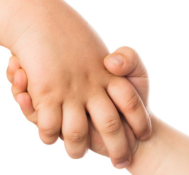 Two children's hand on a white background