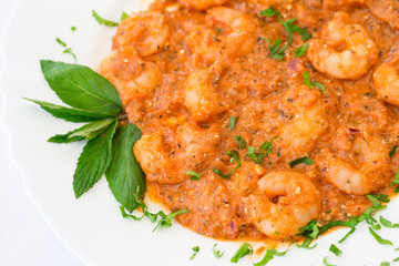 Saganaki prawns/shrimps in taverna, close up, top view