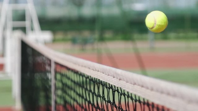 tennis ball hitting net scoring point luck success concept