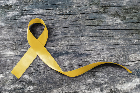 Sarcoma Bone cancer awareness with yellow ribbon symbolic color (isolated with clipping path)