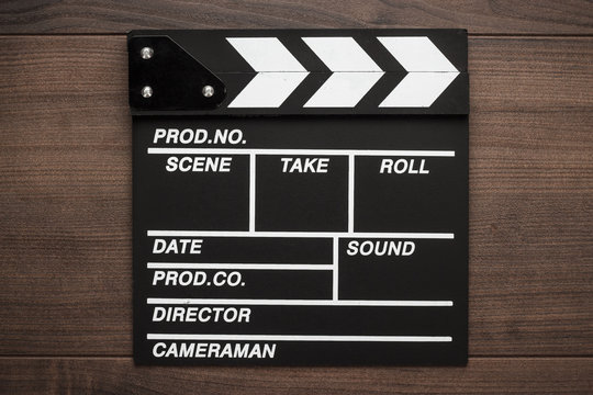 vintage classic clapperboard on brown wooden table