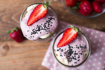 lilac smoothie in jars with strawberry and  bananas selective focus