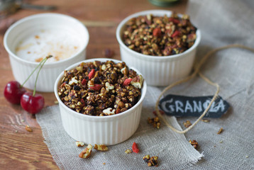 chocolate granola with goji and milk selective focus