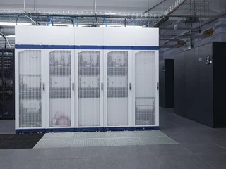 Telecommunication equipment with many cables, switches and air conditioners in a modern communications center © ASHarchenko