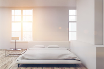 White bed wooden floor toned