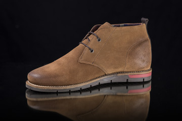 Male Brown Boot on Black Background, Isolated Product, Top View, Studio.