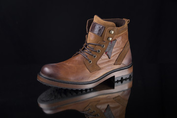 Male Brown Boot on Black Background, Isolated Product, Top View, Studio.
