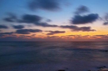 Fototapeta na wymiar Mediterranean sea and evening sky in Israel. The shot using long exposure and contain soft focus.