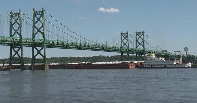 Barge Going Under Bridge On Mississippi River - Wide Shot