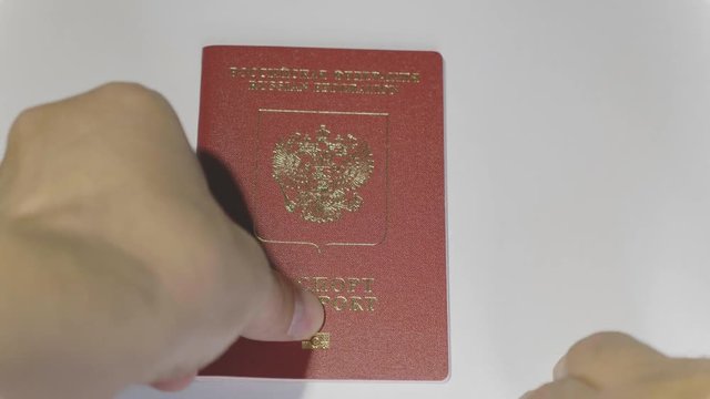 MOSCOW, RUSSIA, JUNE 3, 2017: Taking passport of the citizen of the Russian Federation. Passport is a document certifies the identity of its holder for the purpose of international travel.