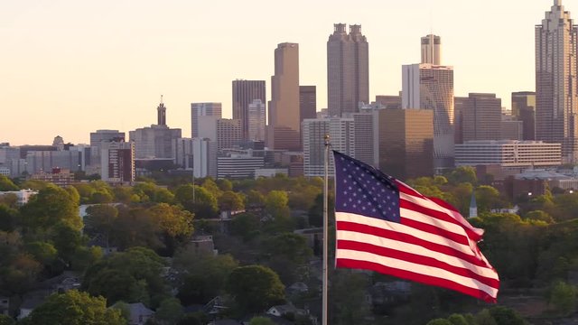 Atlanta Aerial v263 Flying low around American flag with cityscape views at sunset