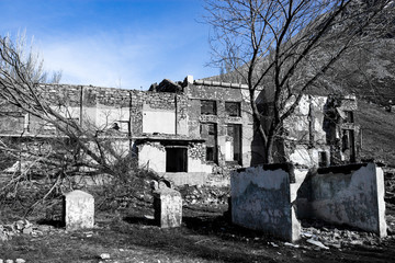 The ruins of an old house against the blue sky