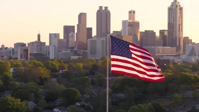Atlanta Aerial v264 Flying low around American flag with cityscape views at sunset