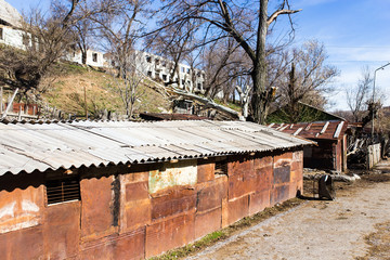 The ruins of an old house against the blue sky