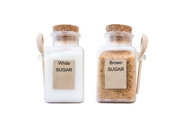 Isolated in white, glass bottle with wooden cog white and brown sugar bottle with wooden spoon