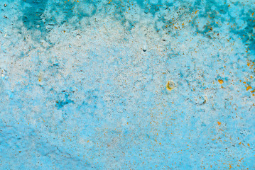 Cracked paint on old metal texture. Blue color. Rusted surface