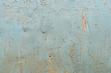 Cracked paint on old metal texture. Blue color. Rusted surface