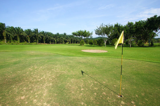 Yellow flag marker on gold course