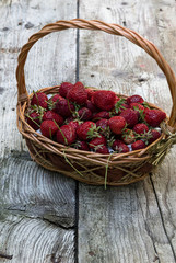 Fototapeta na wymiar Fresh strawberries on an old wooden surface