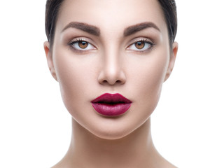 Beauty girl face portrait isolated on white. Model woman with perfect makeup looking at camera