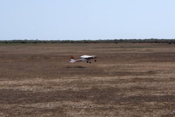 A model airplane stunt plane spinning. Model: tri 60