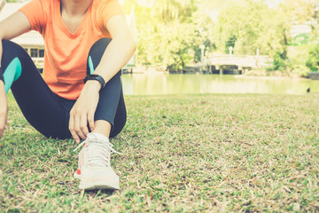 Attractive confidence asian woman runner resting tired after a run