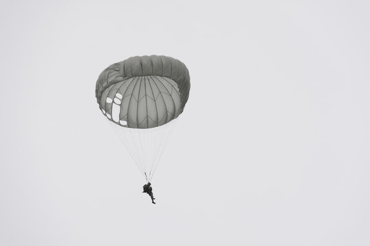 Parachute soldiers in the sky.
