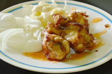 fried chicken wing stick with slice vegetable dressing mayonnaise on plate