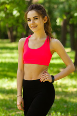 The woman is engaged in fitness in the Park