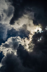 dark clouds in bad weather with sunshine