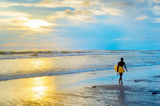 Silhouette of surfer. Bali island