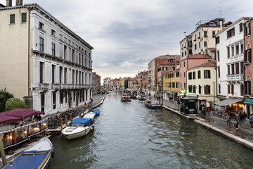 Fototapeta na wymiar Venice, Veneto / Italy- May 20, 2017: View of the canals from the bridge called 