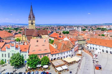 Deurstickers Sibiu, Romania, Lutheran cathedral tower and Small Square (Piata Mica). © SCStock