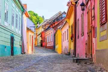 Fototapete Rund Sighisoara, Romania. Medieval street with houses in Transylvania. © SCStock