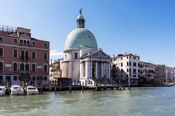 Fototapeta na wymiar Venice, Veneto / Italy- May 20, 2017: View of the church of San Simeon Piccolo from the canal