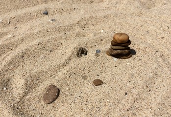Fototapeta na wymiar Stones on the sand of seashore