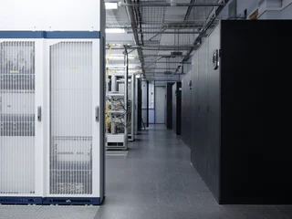 Telecommunication equipment with many cables, switches and air conditioners in a modern communications center © ASHarchenko