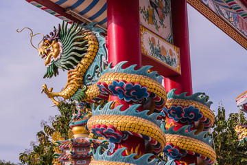 Back two chinese power dragon statue on gatepost or chinese dragon zodiac in Chonburi Thailand
