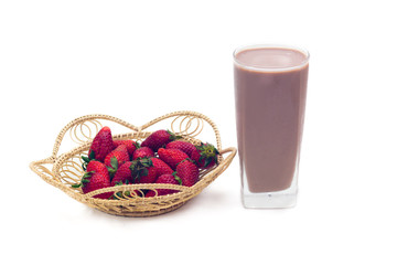 Red strawberries on basket with chocolate milk isolated on white