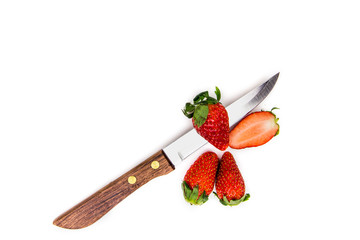 Knife and strawberries isolated on white