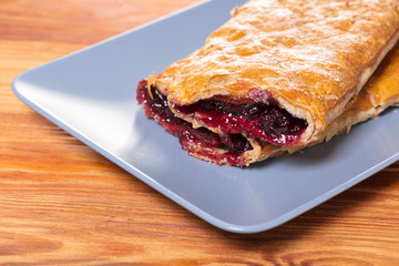 Baking, cherry strudel in a plate