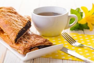 Baking strudel with poppy seeds and tea