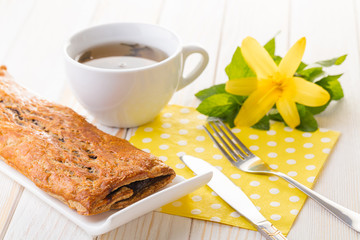 Baking strudel with poppy seeds and tea
