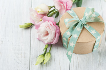 Eustoma flower and gift box with star green ribbon