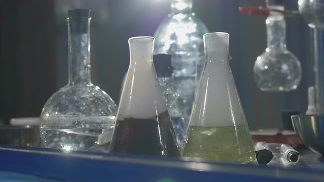The scientist and his assistant conduct chemical experiments in an underground laboratory in Slow motion