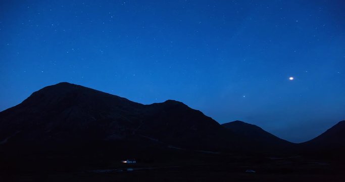timelapse of stars and clouds moving over buchaille etive mor in scotland near glencoe